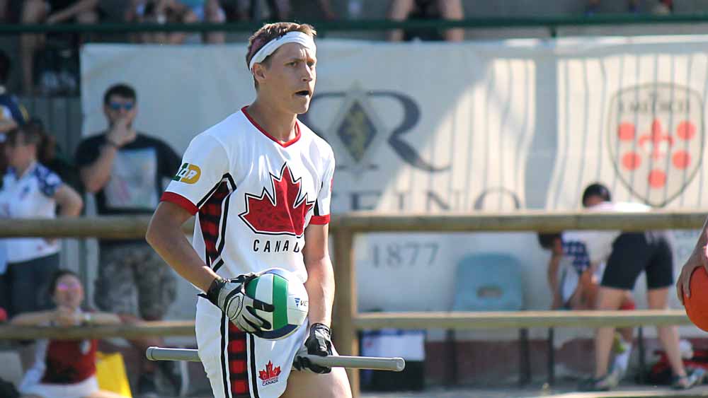 Male quidditch player wearing the 2018 Quidditch Canada light kit.